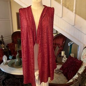 Sleeveless cute Cardigan casual medium length. Great accessory for any outfit.